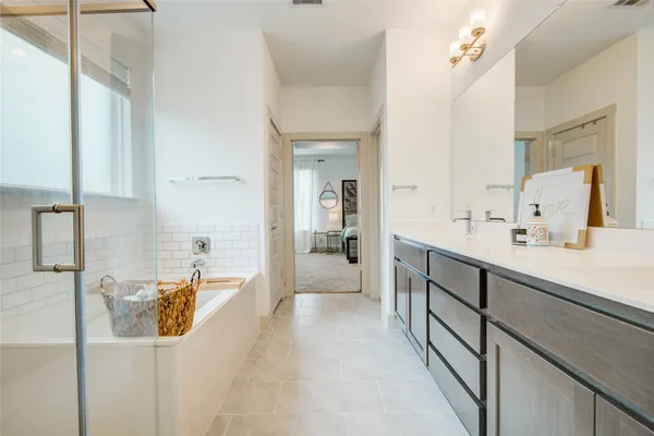 a view of a bathroom with a tub shower