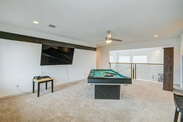 a patio with table and chairs and a big yard
