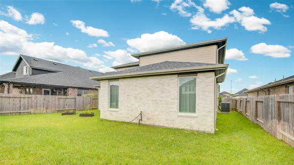 a view of an house with backyard porch and furniture