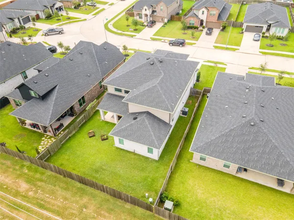 an aerial view of residential houses with outdoor space