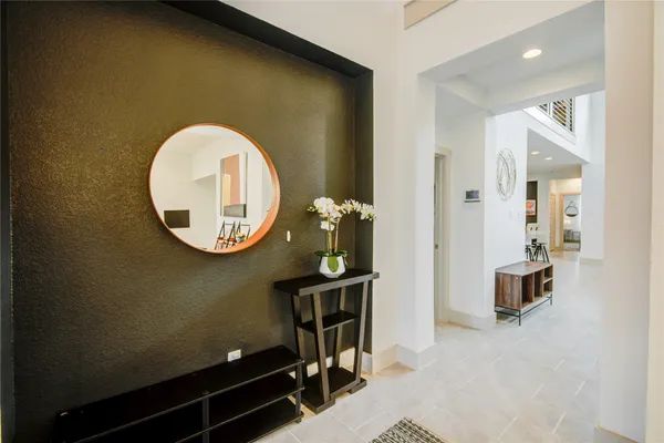 a bathroom with a sink mirror and toilet