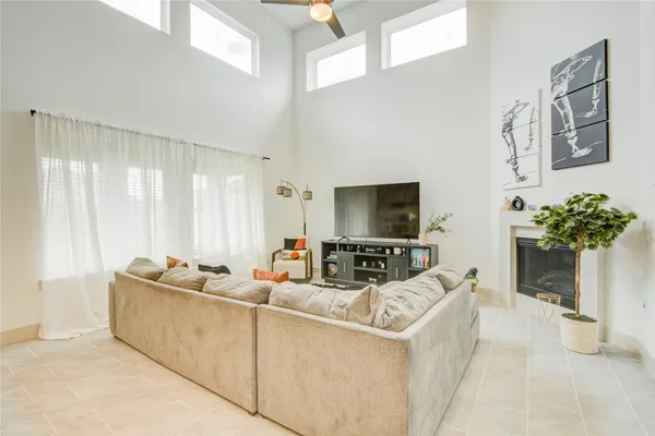 a living room with furniture kitchen and a fireplace