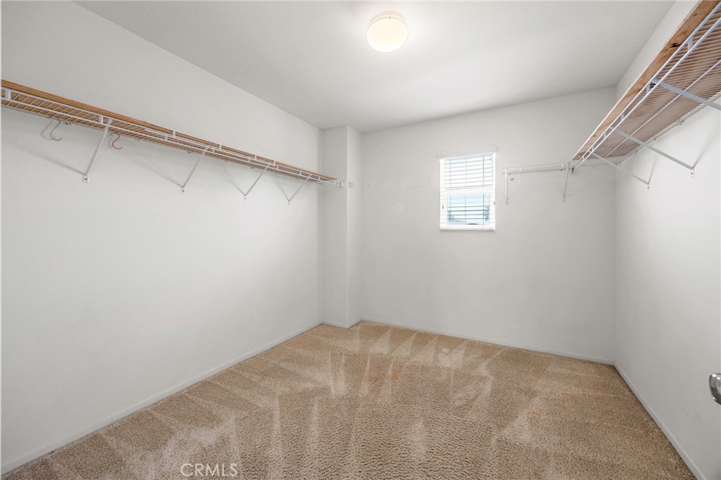 151 Ropango Way Hemet, CA 92545 - Photo 22 of 28 a view of a room with racks on the wall