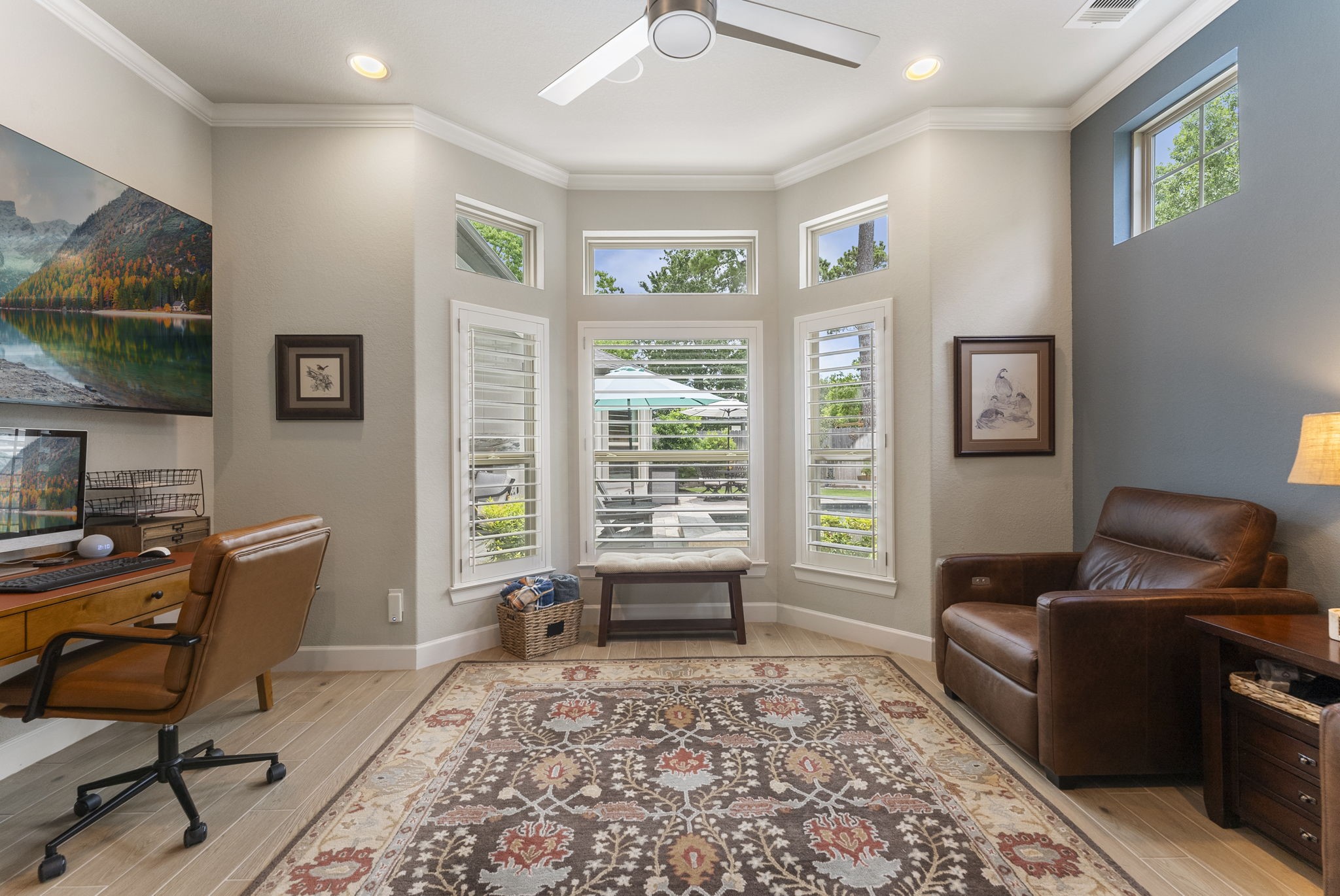 25607 Muirfield Bend Court Spring, TX 77389 - Photo 7 of 30 Private executive study featuring a wall of oversized windows, tranquil outdoor views, and abundant natural light—creating an inspiring environment for work, reading, or quiet reflection.