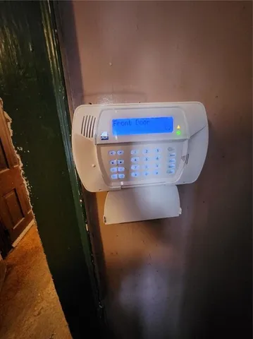 a view of a livingroom with a ceiling fan and a chandelier fan