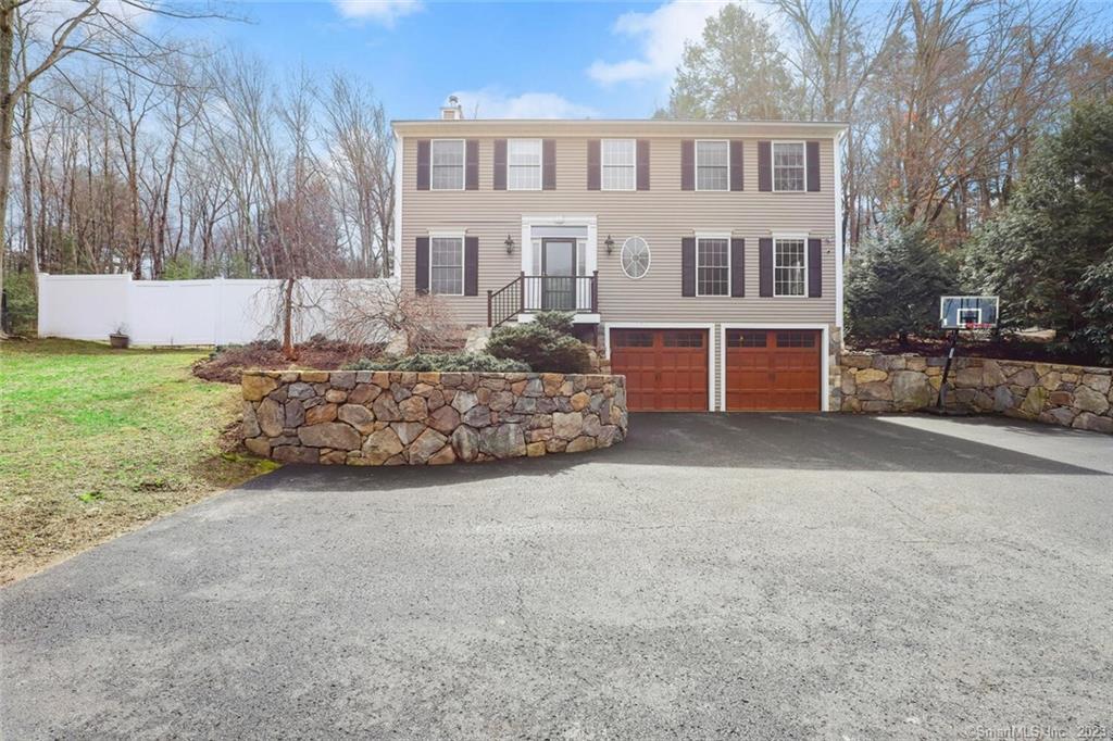 100 Glen Road Newtown, CT 06482 - Photo 1 of 1 a view of a house with a yard and garage