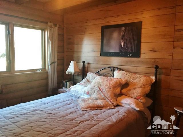 35155 Tool Box Spring Road Mountain Center, CA 92561 - Photo 12 of 27 a bed sitting in a bedroom next to a window