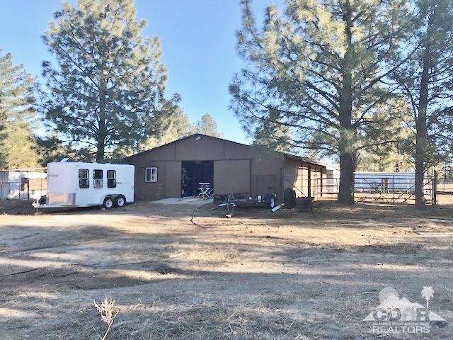 35155 Tool Box Spring Road Mountain Center, CA 92561 - Photo 16 of 27 a view of a house with a yard covered in snow