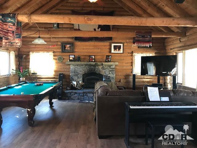 35155 Tool Box Spring Road Mountain Center, CA 92561 - Photo 4 of 27 a living room with furniture and a fireplace