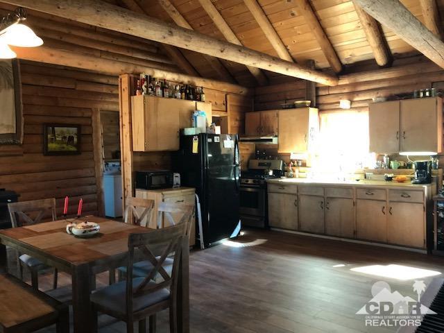 35155 Tool Box Spring Road Mountain Center, CA 92561 - Photo 8 of 27 a kitchen with sink cabinets and wooden floor