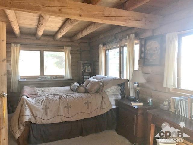 35155 Tool Box Spring Road Mountain Center, CA 92561 - Photo 10 of 27 a bed sitting in a bedroom next to a window