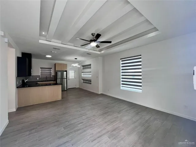a view of a kitchen with a sink and a stove top oven