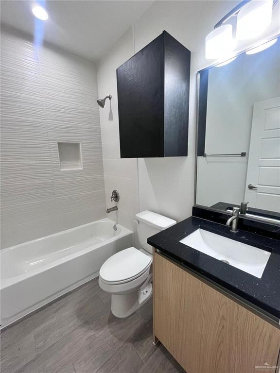 3900 Ventura Avenue, Unit 3 Edinburg, TX 78541 - Photo 8 of 14 a bathroom with a granite countertop sink and a mirror