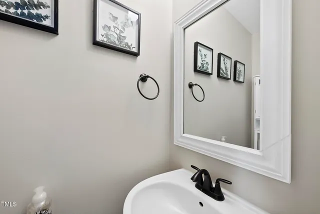 a bathroom with a sink and mirror