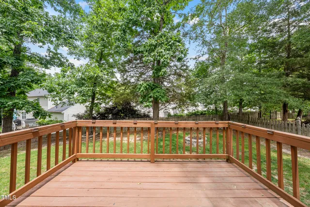 a view of a balcony with wooden floor