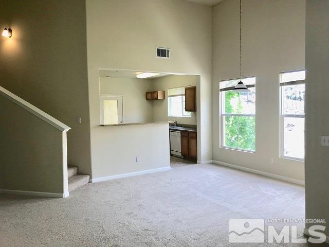 9050 Double R Boulevard, Unit 1125 Reno, NV 89511 - Photo 7 of 24 an empty room with windows and cabinet