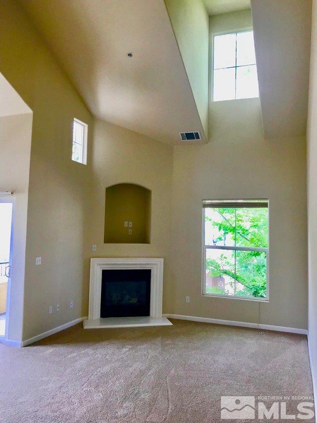 9050 Double R Boulevard, Unit 1125 Reno, NV 89511 - Photo 8 of 24 an empty room with windows