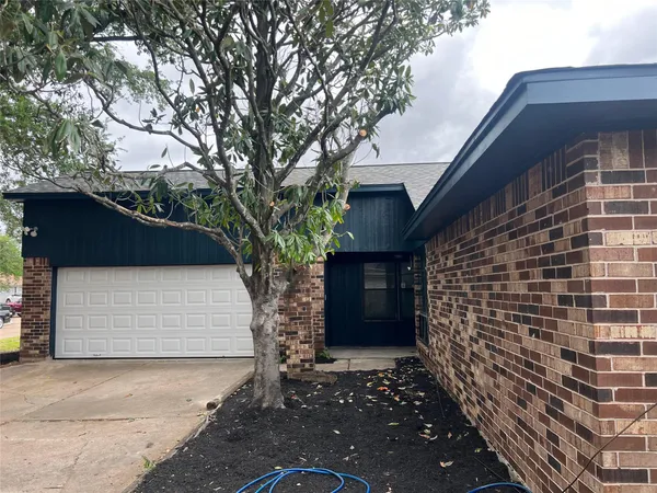 a front view of a house with a garage