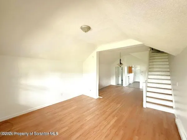 a view of a big room with closet and a large window