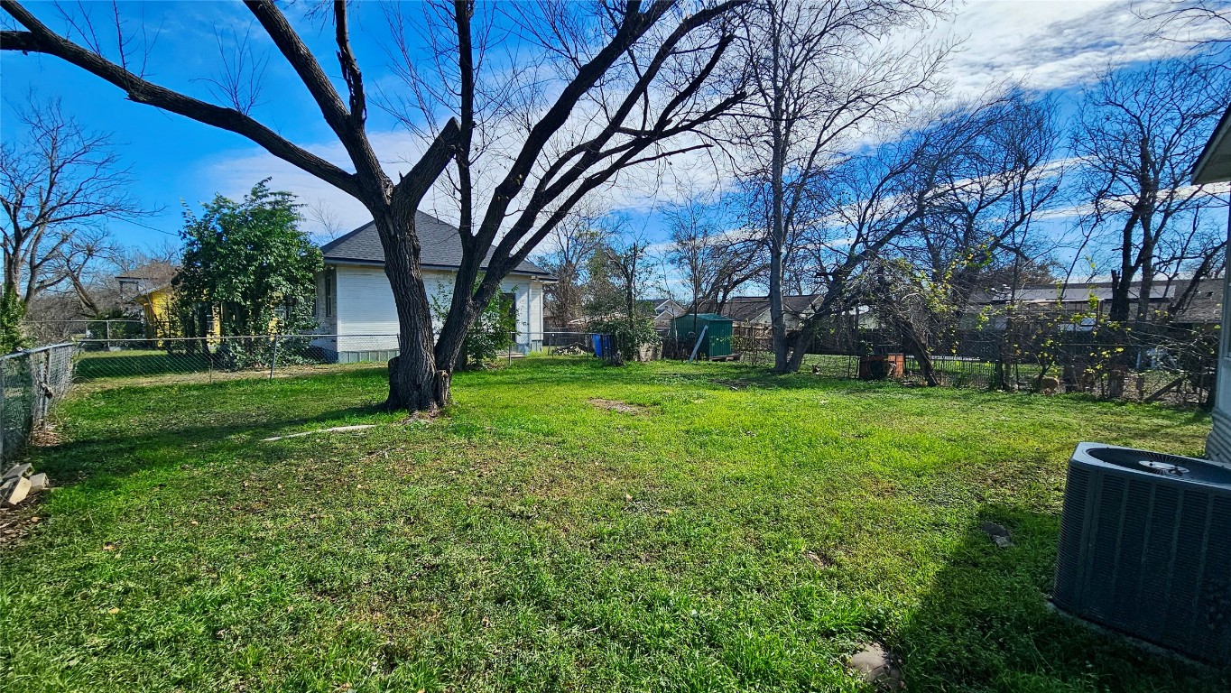 919 West 6th Street Taylor, TX 76574 - Photo 13 of 16 a view of a backyard with large trees