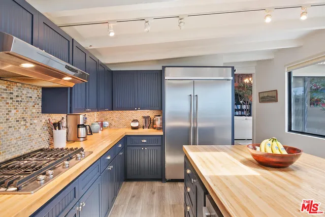 a kitchen with a sink and refrigerator