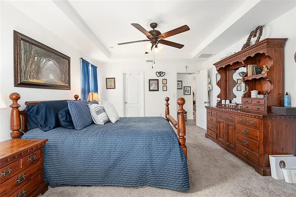 a bed room with a bed and dresser