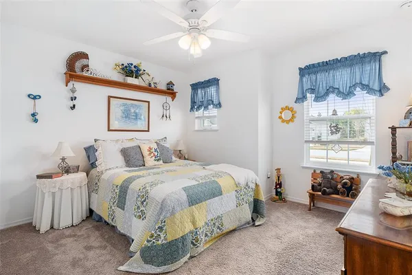 a bedroom with bed and a window