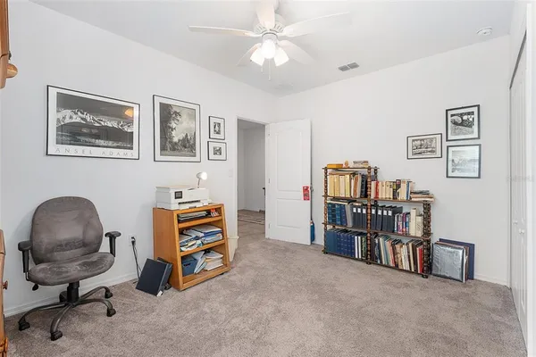 a view of a workspace with furniture and a couch