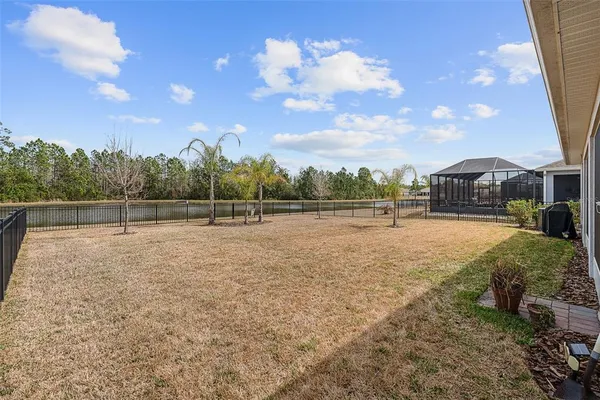 a view of outdoor space with playground and green space