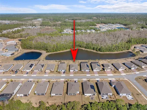 a view of swimming pool with a table and chairs