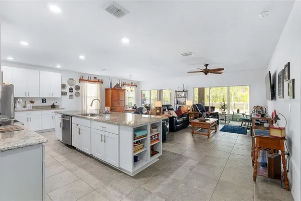 a large white kitchen with lots of counter top space