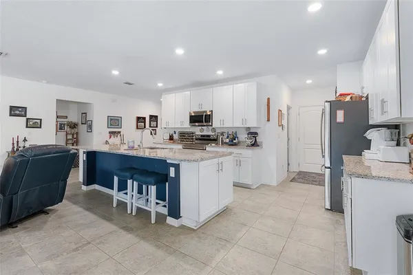 a kitchen with a sink and refrigerator