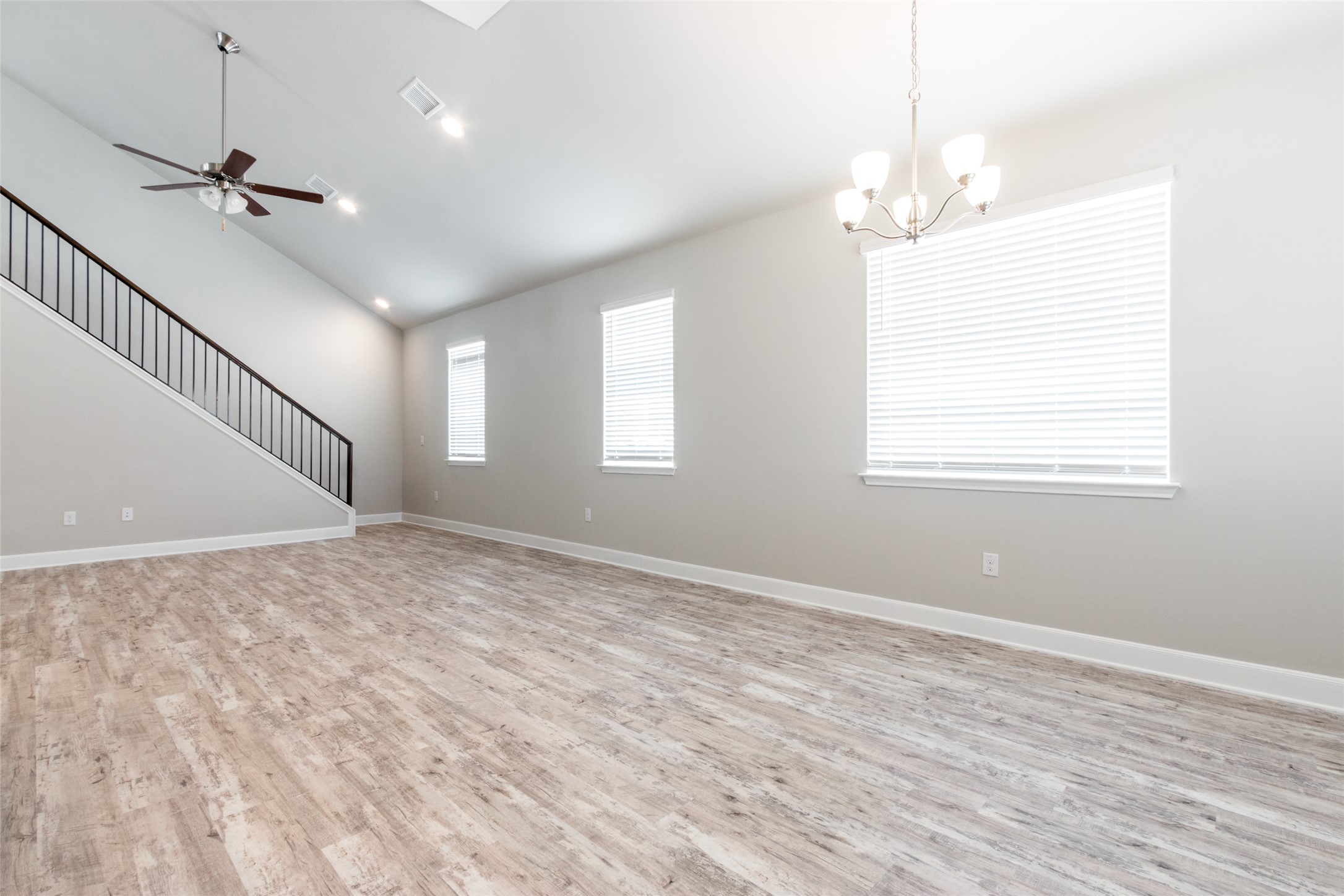 9301 Alex Lane Austin, TX 78748 - Photo 9 of 40 a view of empty room with wooden floor and fan