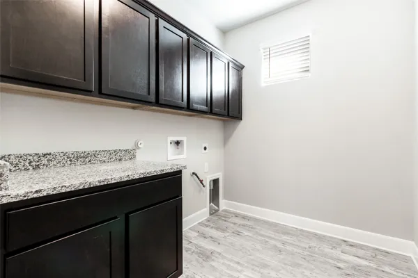 a kitchen with stainless steel appliances granite countertop a stove microwave and sink