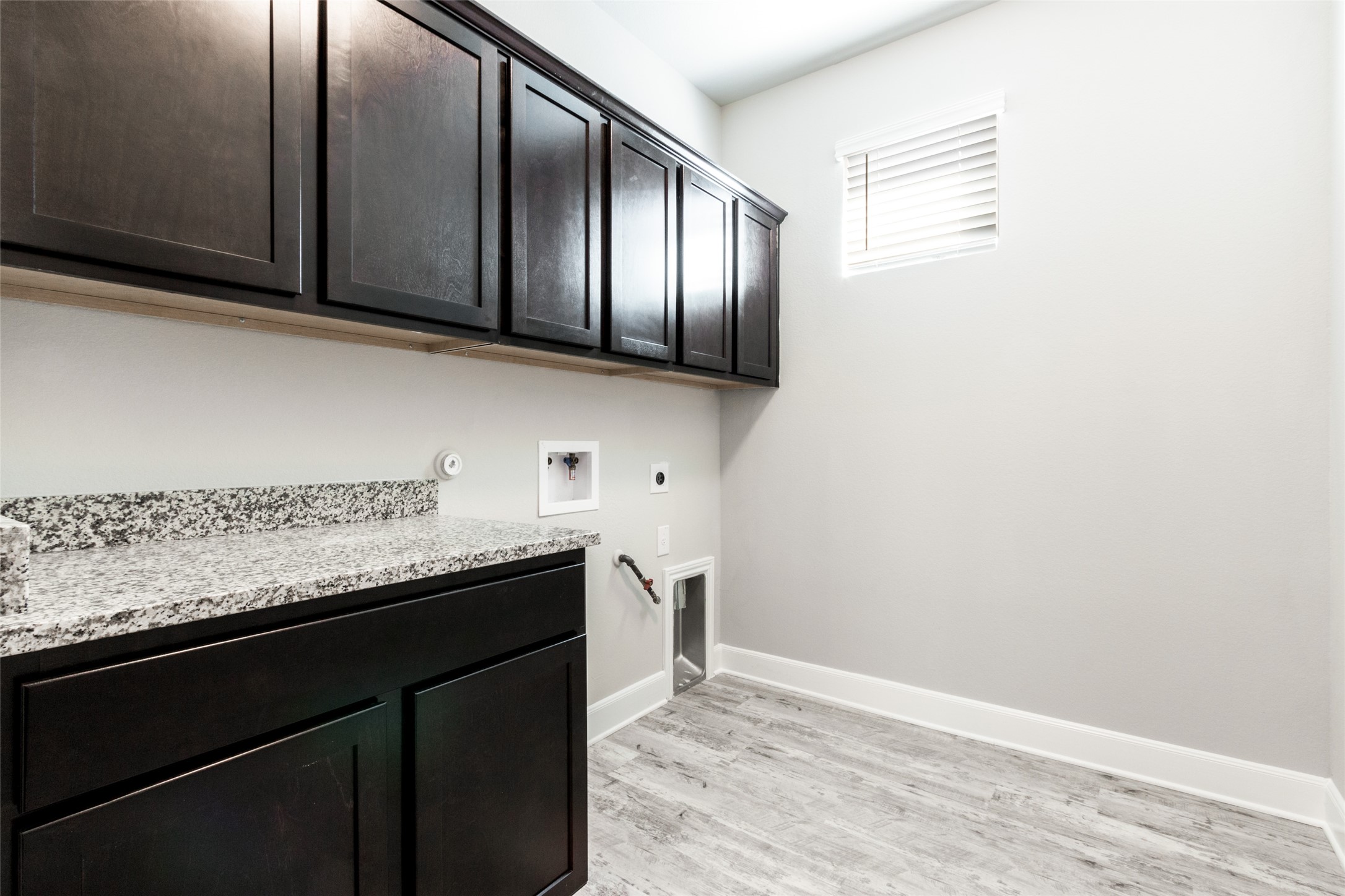 9301 Alex Lane Austin, TX 78748 - Photo 15 of 40 a kitchen with granite countertop stainless steel appliances a sink and cabinets