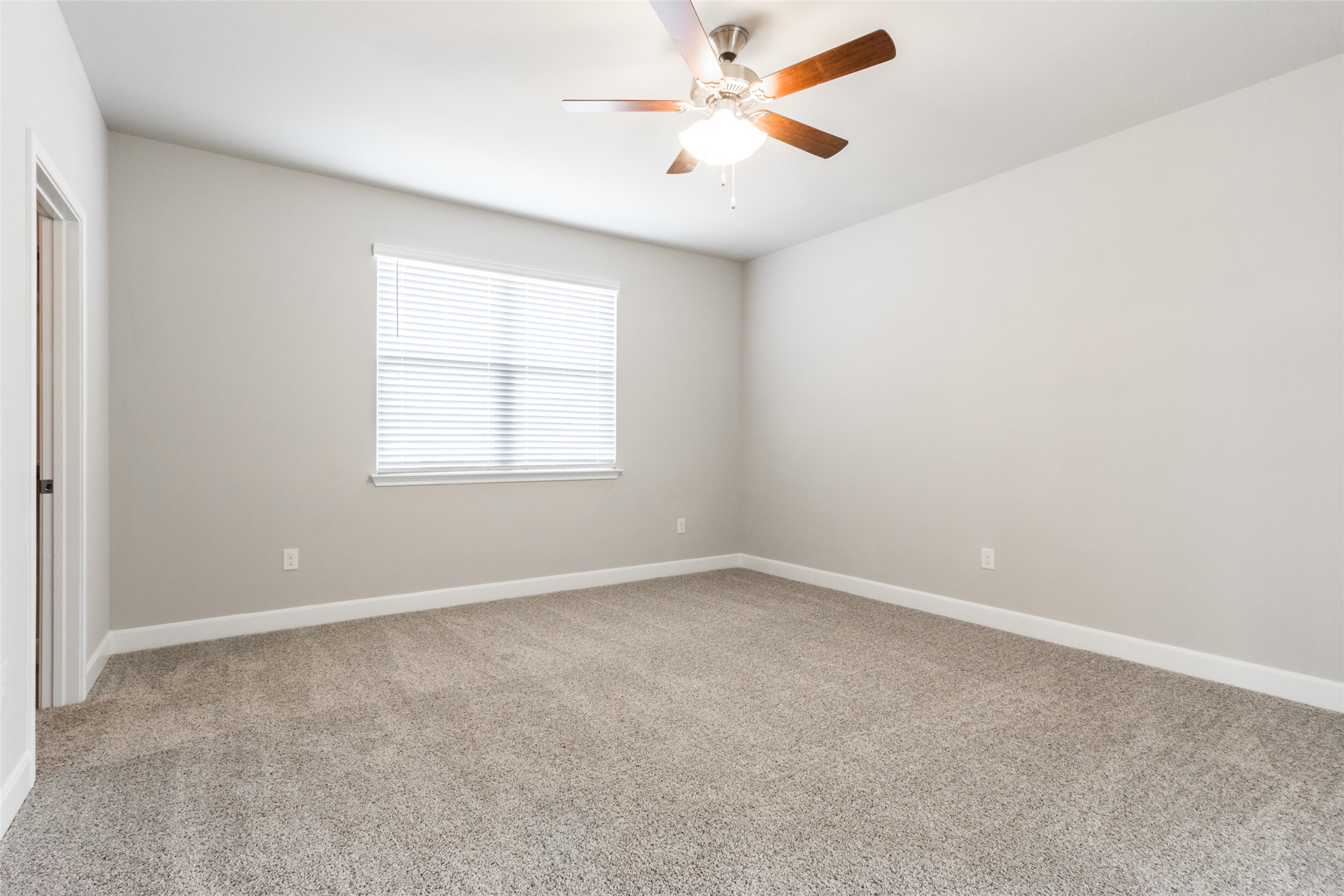 9301 Alex Lane Austin, TX 78748 - Photo 16 of 40 an empty room with a window and a fan