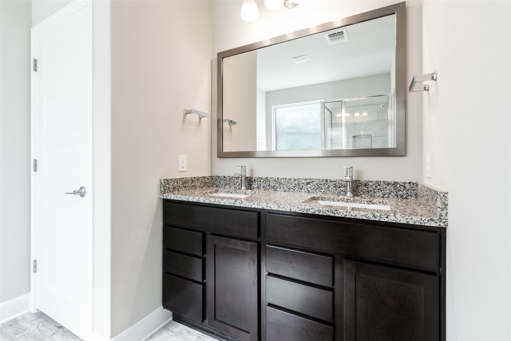 9301 Alex Lane Austin, TX 78748 - Photo 22 of 40 a bathroom with a granite countertop sink and a mirror