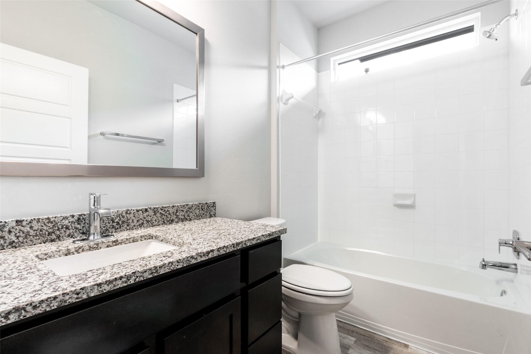 9301 Alex Lane Austin, TX 78748 - Photo 6 of 40 a bathroom with a granite countertop sink toilet and shower