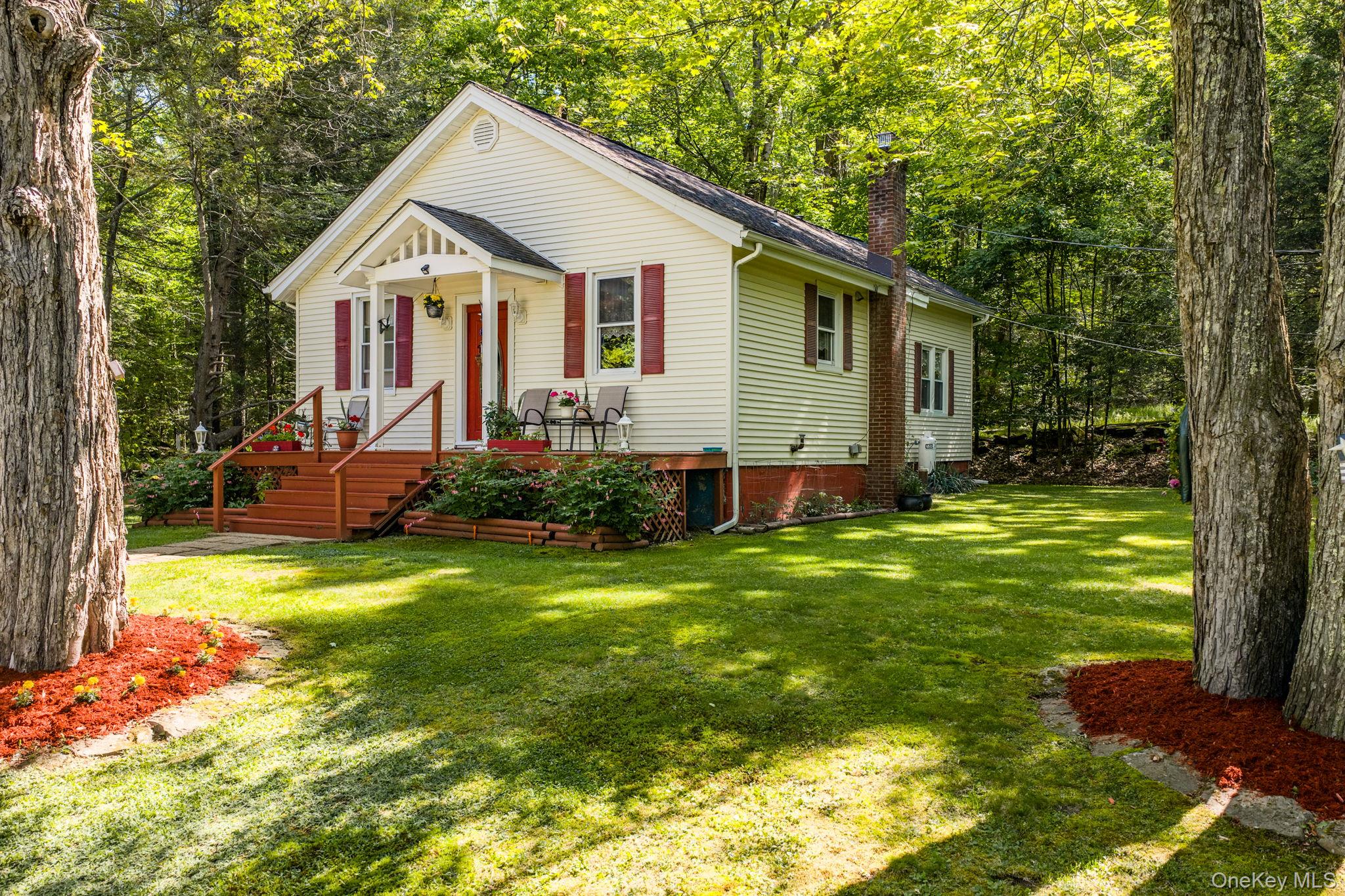 370 Starlight Road Monticello, NY 12701 - Photo 3 of 49 a front view of house with yard and green space