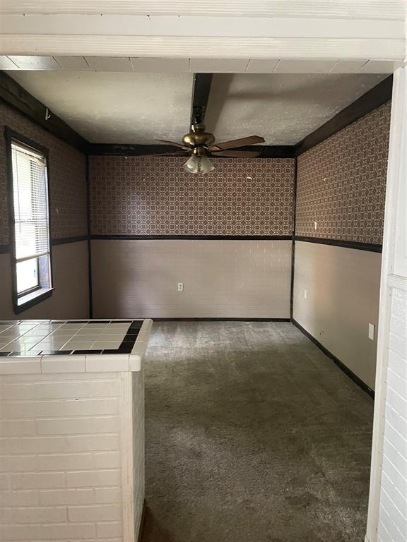 241 Aurora Street Rhome, TX 76078 - Photo 20 of 28 Formal dining featuring carpet floors