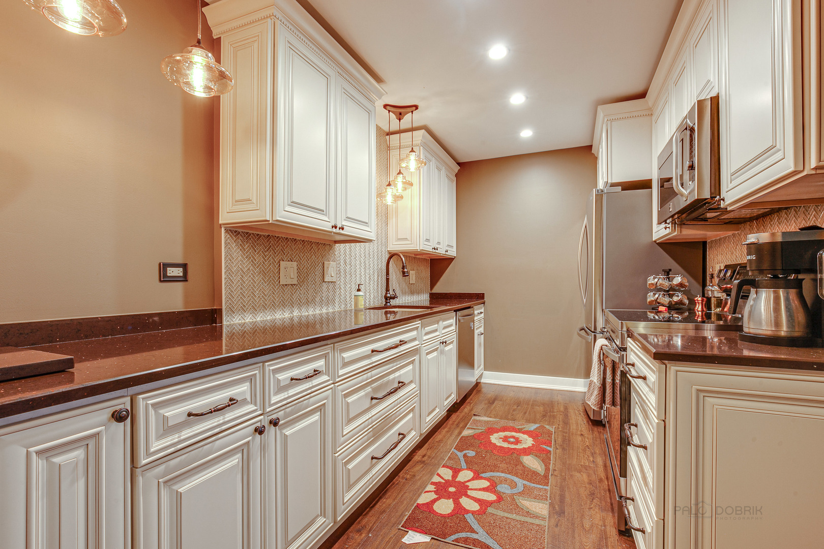 2300 Windsor Mall, Unit 2E Park Ridge, IL 60068 - Photo 14 of 23 a kitchen with granite countertop a sink and cabinets