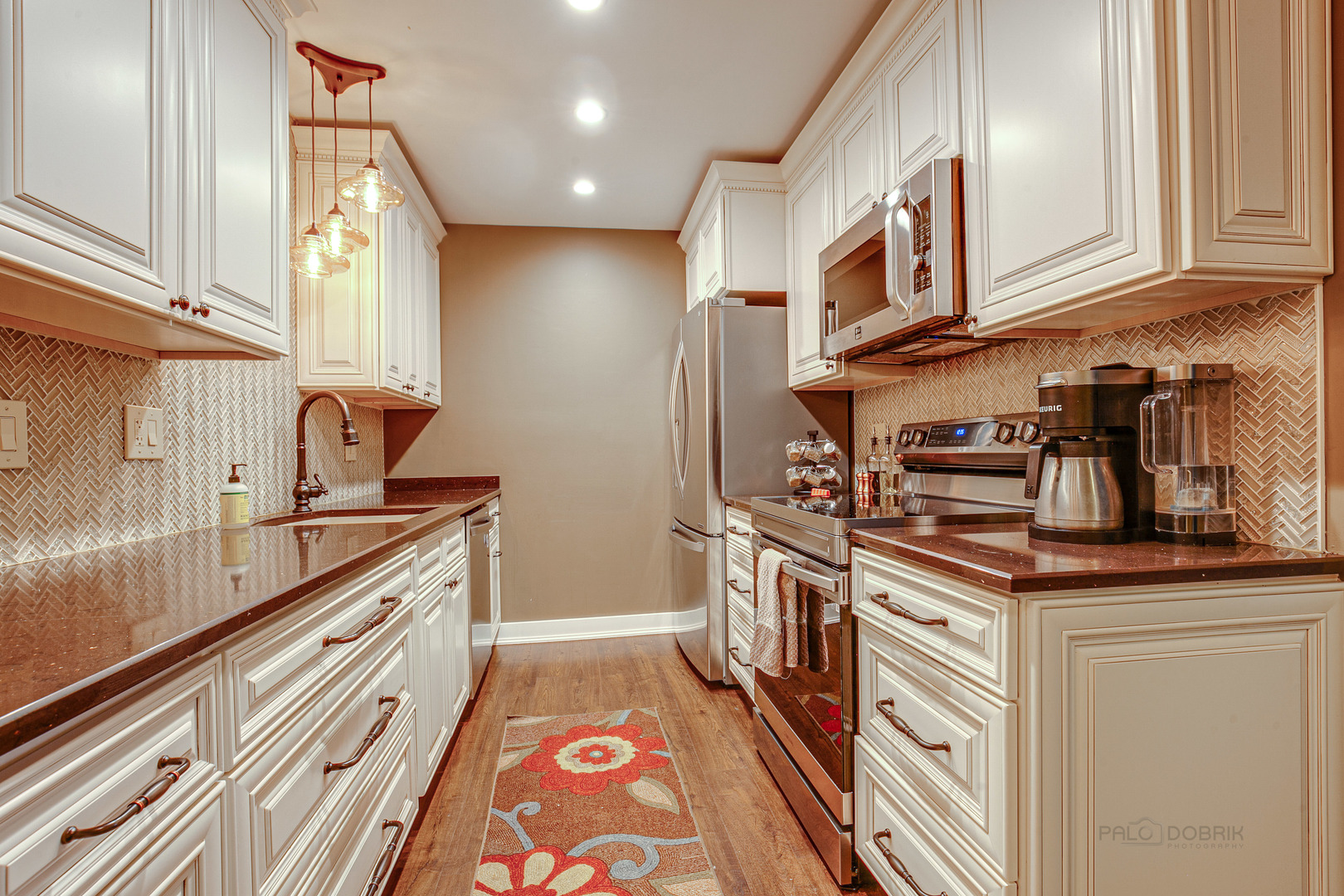 2300 Windsor Mall, Unit 2E Park Ridge, IL 60068 - Photo 15 of 23 a kitchen with stainless steel appliances granite countertop a sink and cabinets