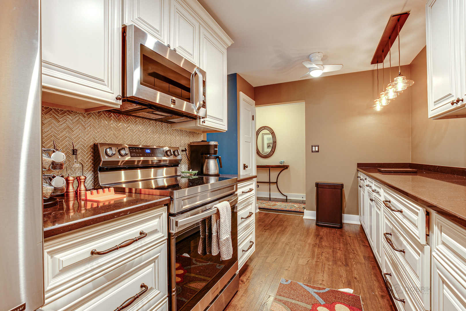 2300 Windsor Mall, Unit 2E Park Ridge, IL 60068 - Photo 16 of 23 a kitchen with stainless steel appliances granite countertop a stove and a microwave