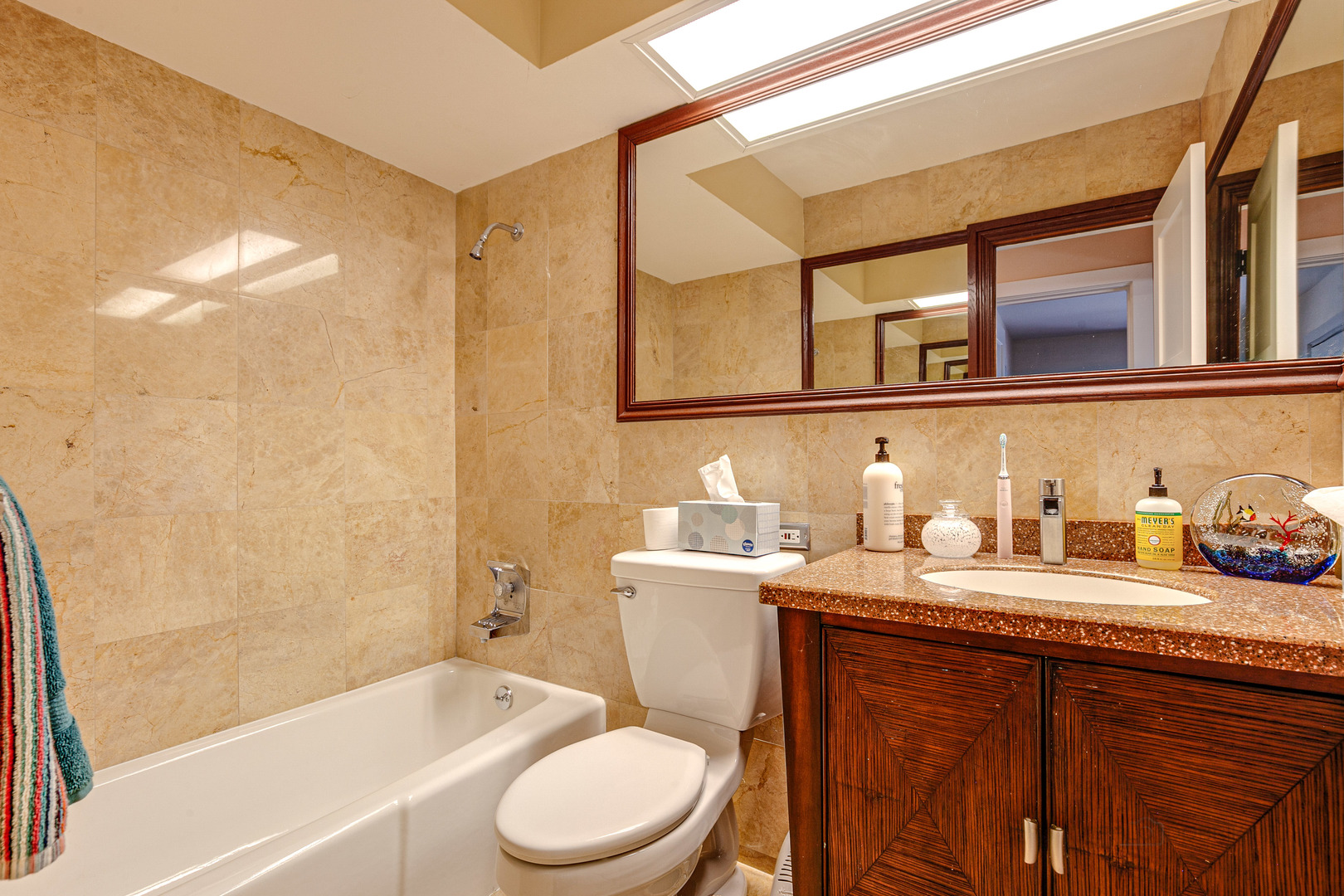 2300 Windsor Mall, Unit 2E Park Ridge, IL 60068 - Photo 17 of 23 a bathroom with a granite countertop sink a toilet and bathtub