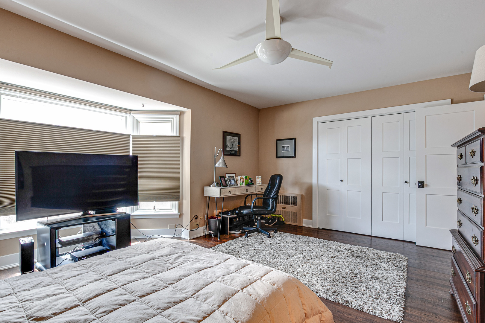 2300 Windsor Mall, Unit 2E Park Ridge, IL 60068 - Photo 19 of 23 a bedroom with furniture and a flat screen tv