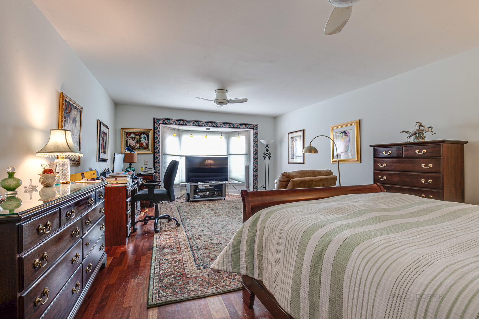2300 Windsor Mall, Unit 2E Park Ridge, IL 60068 - Photo 21 of 23 a bedroom with double bed and a dresser