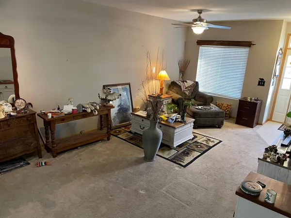 a room with gym equipment and a flat screen tv