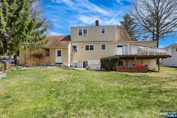 a view of a house with a back yard