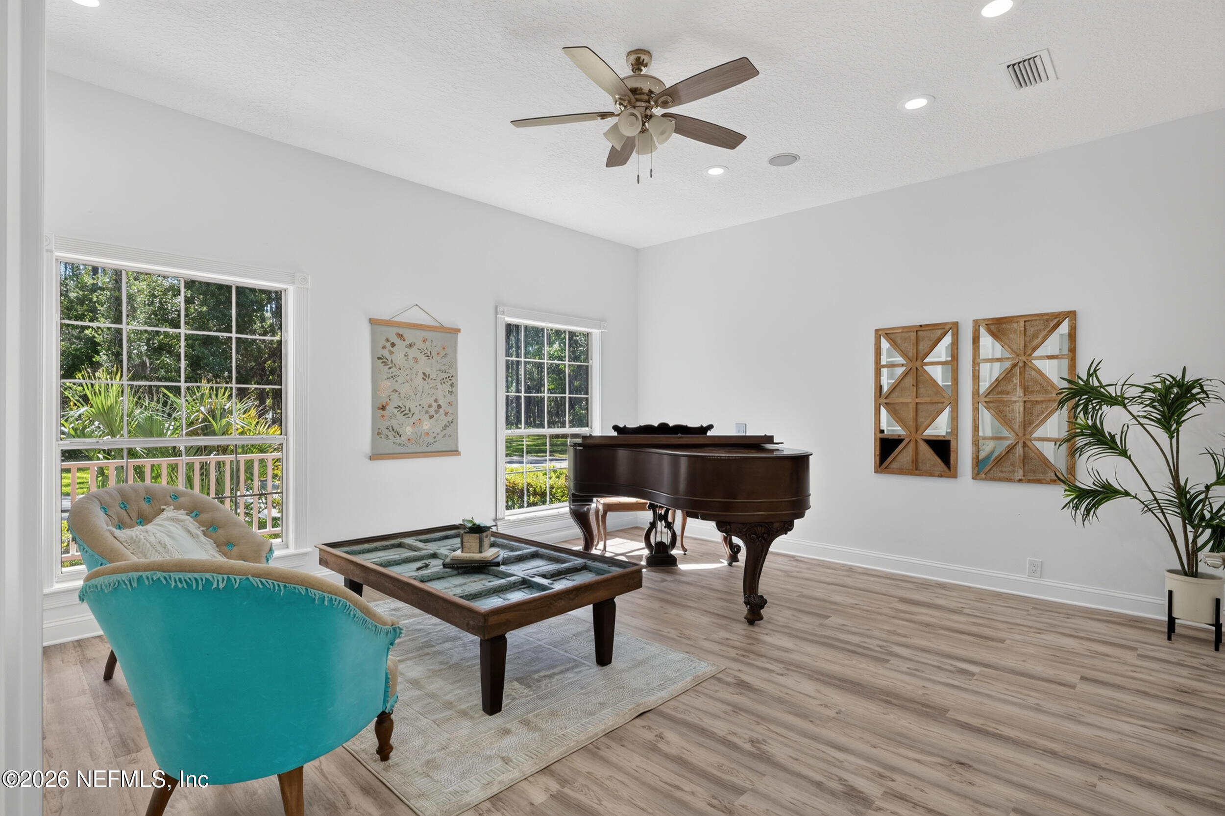 3090 Monument Bay Road St. Augustine, FL 32092 - Photo 37 of 56 a living room with furniture and a potted plant