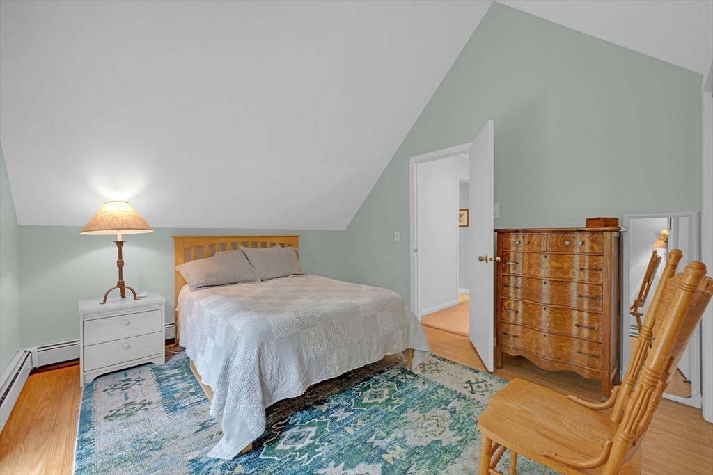 47 Horseshoe Circle Ware, MA 01082 - Photo 26 of 37 a bedroom with a bed and wooden floor